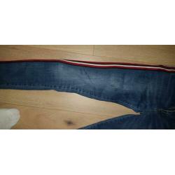 Retour jeans met rood wit zwarte band mt 14